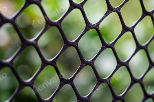 Preview: Close-Up of Plastic Netting Against Natural Background