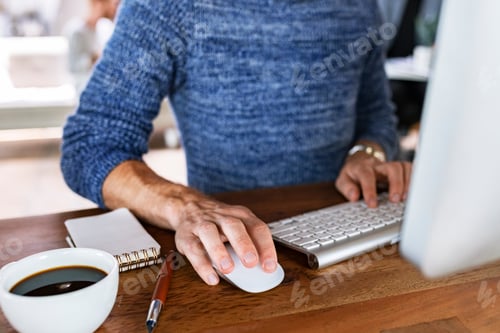 Preview: Businessman typing on a keyboard