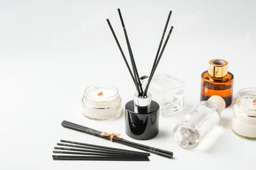 Preview: Aromatic essentials including scented candles, incense sticks, and diffusers arranged on a light