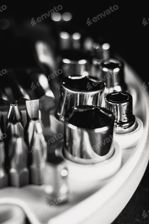 Preview: Selective focus shot of a new set of screwdrivers bits and socket heads in a toolbox
