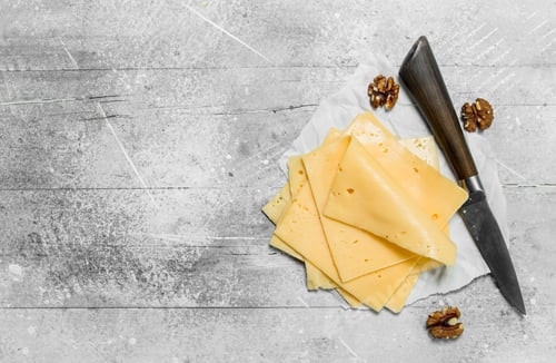 Preview: Thin slices of cheese with walnuts.