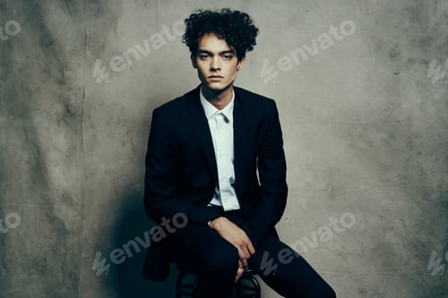 Preview: business man in a suit sitting on a chair fashion modern style Professional