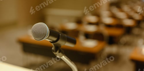 Preview: Close up of microphone on stage in meeting room. Blurred background. Microphone, stage, room,