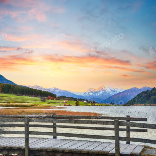 Preview: Gorgeous autumn view of Haidersee (Lago della Muta) lake with Ortler peak on background.