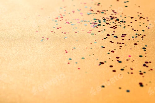 Preview: Colorful of confetti on gold background. Brilliant colored sequins. Holiday greeting card.