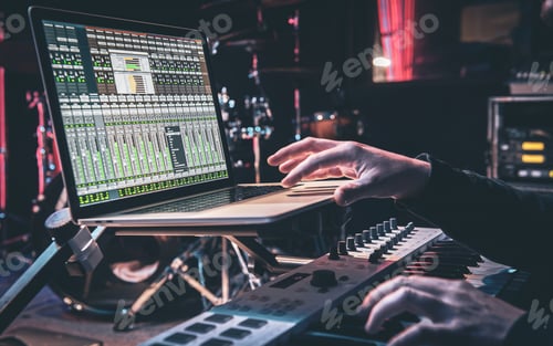 Preview: Creative Adult Composing Music with Synthesizer and Laptop