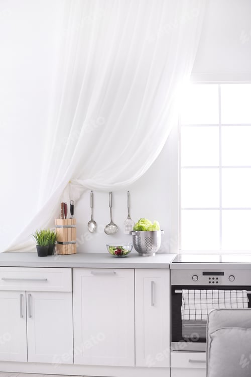 Preview: Light kitchen interior with modern oven and window