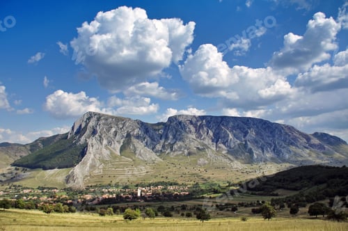 Preview: Epic rocky mountain above a village. Szekellyko, Torocko, Transylvania, Romania