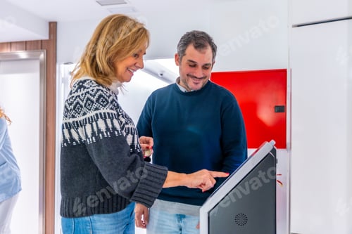 Preview: Patients scheduling appointments at the hospital using a modern machine