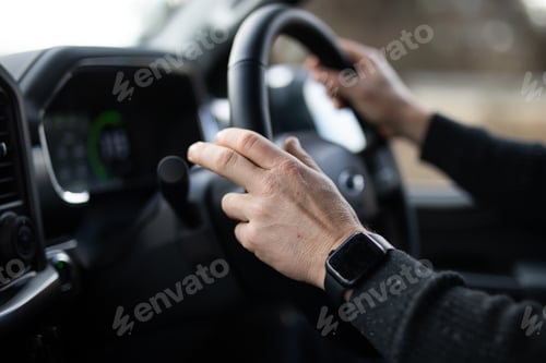 Preview: male caucasian hand driving car steering watch jumper destination holiday work navigate