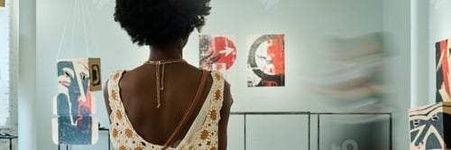 Preview: Back of female visitor of vernissage
