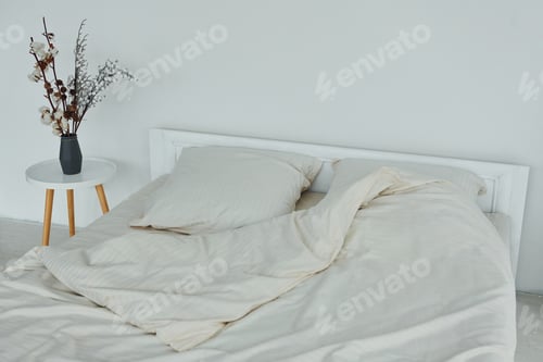 Preview: White bed. Interior and design of beautiful modern bedroom at daytime
