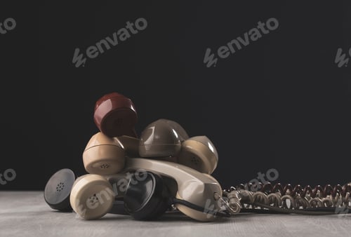 Preview: Many vintage phone receivers stacked