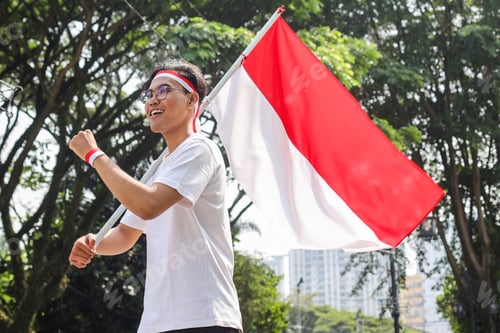 Preview: Man Waving Red and White Flag Outdoors