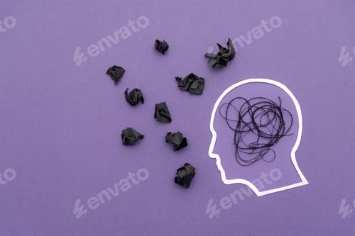 Preview: Human Head with black tangled thread and crumpled paper on purple background,mental stress