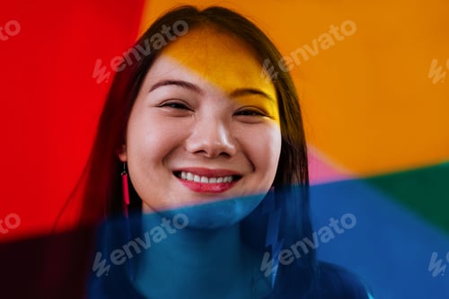 Preview: Stylish young woman laughing with colorful fashion accessories