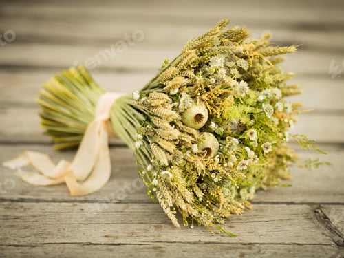 Preview: bouquet of dried flowers. Still life with wheat ears and yellow and white wildflowers.