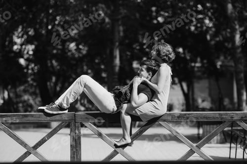 Preview: beautiful young couple resting on a fence