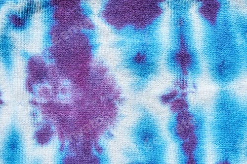Preview: Abstract blue and purple tie dye pattern on fabric with symmetrical design