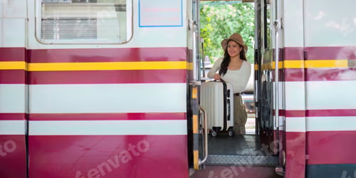 Vista previa: Woman with suitcase get on the train Tourist adventure holiday traveling concept. lifestyle active