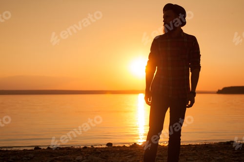 Preview: Man on shore in sunset