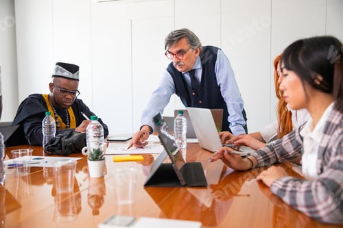 Preview: Work meeting in a corporate, the boss explains the work to the employees, multi ethnic group