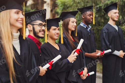 Preview: Group of multiethnic students on graduation day