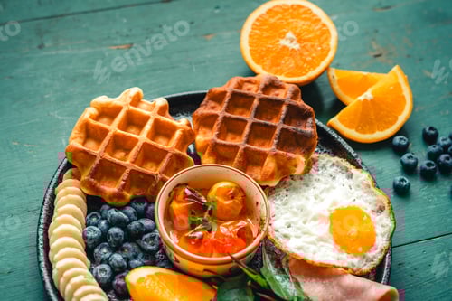 Preview: Waffles with Fried Eggs fruit and ham.