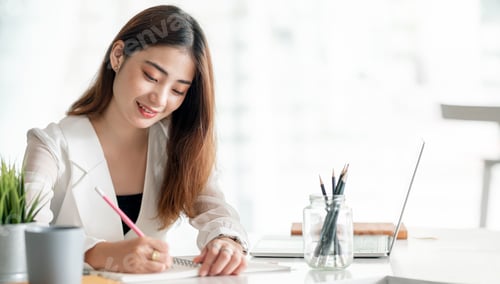 Preview: Beautiful businesswoman working with happiness at office.