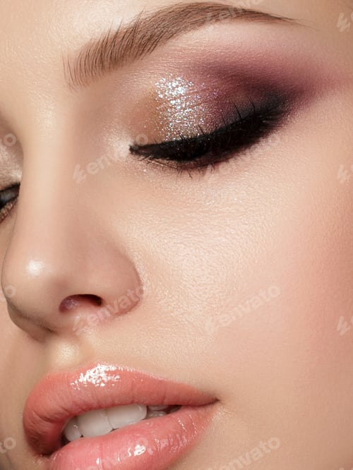 Preview: Young beautiful woman with evening make up