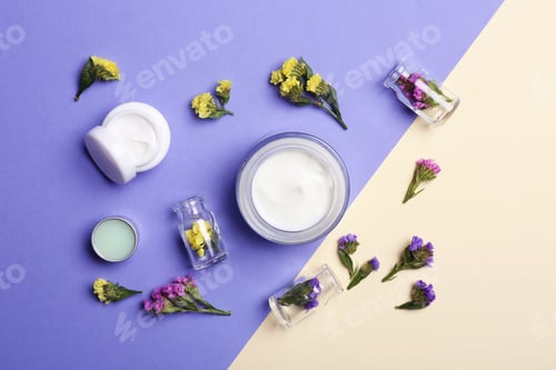 Preview: Flat lay composition with jars of body cream on color background