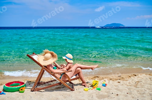 Preview: Toddler boy on beach with mother