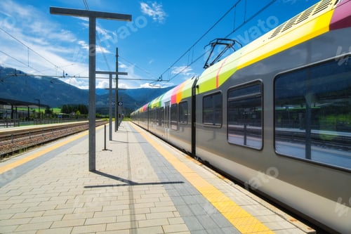 Preview: High-speed green passenger train at railway station platform