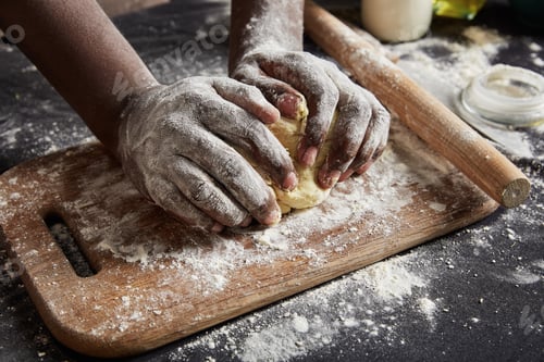 Preview: Unrecognizable dark skinned male with dirty hands, kneads pastry, prepares tasty pie, works as chef