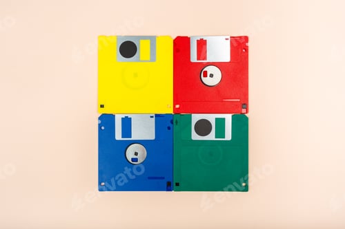 Preview: Colorful floppy disks arranged in a square on a plain background