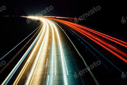 Preview: Moving car lights on highway at night, long exposure