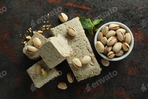 Preview: Concept of tasty food with halva on dark textured background