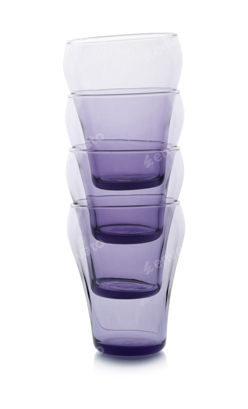 Preview: Stack of empty colorful glasses on white background