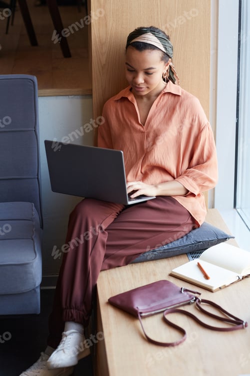 Preview: Young Business Blogger Working in Cafe