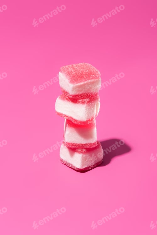 Preview: stack of delicious gummy candies on pink surface