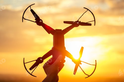 Preview: drone in the hand of a man in the sunlight