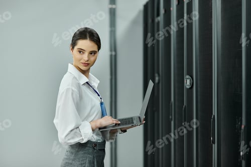 Preview: A woman in a white shirt skillfully manages tasks in a modern server room filled with hardware.