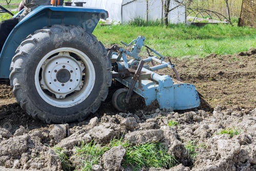 Preview: The tractor loosens and prepares the soil before sowing