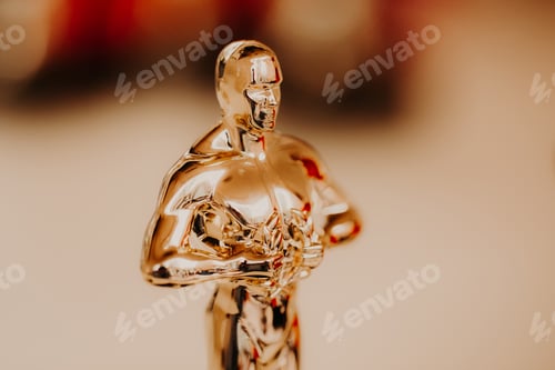 Preview: Nomination and Oscar reward concept. Golden statue for victory and success. Academy reward