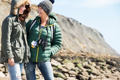 Preview: Mother and daughter laughing by seaside, Folkestone, UK