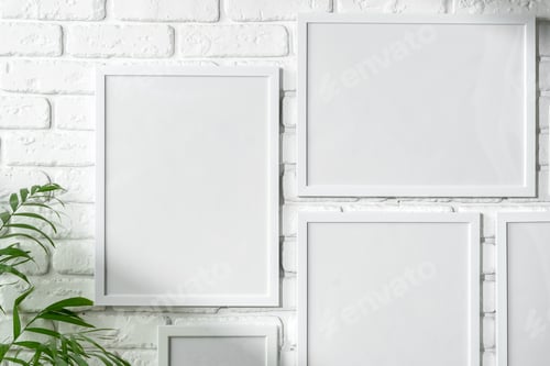 Preview: Varied Sized Photo Frames Displayed on a White Brick Wall