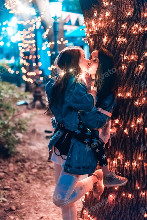 Preview: mom kisses her daughter in the evening park