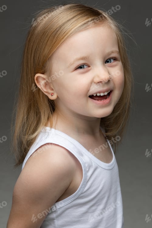 Preview: Adorable kid laughing during the photo session