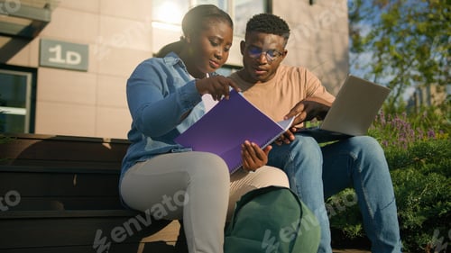 Preview: Two African students high school pupils girl guy in college campus outdoors in city park outside on
