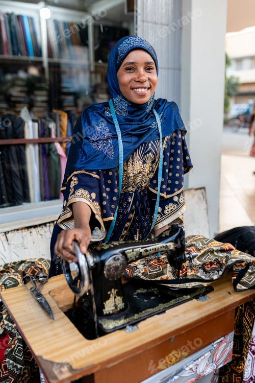 Preview: Portrait of an african muslim dressmaker at outdoor atelier